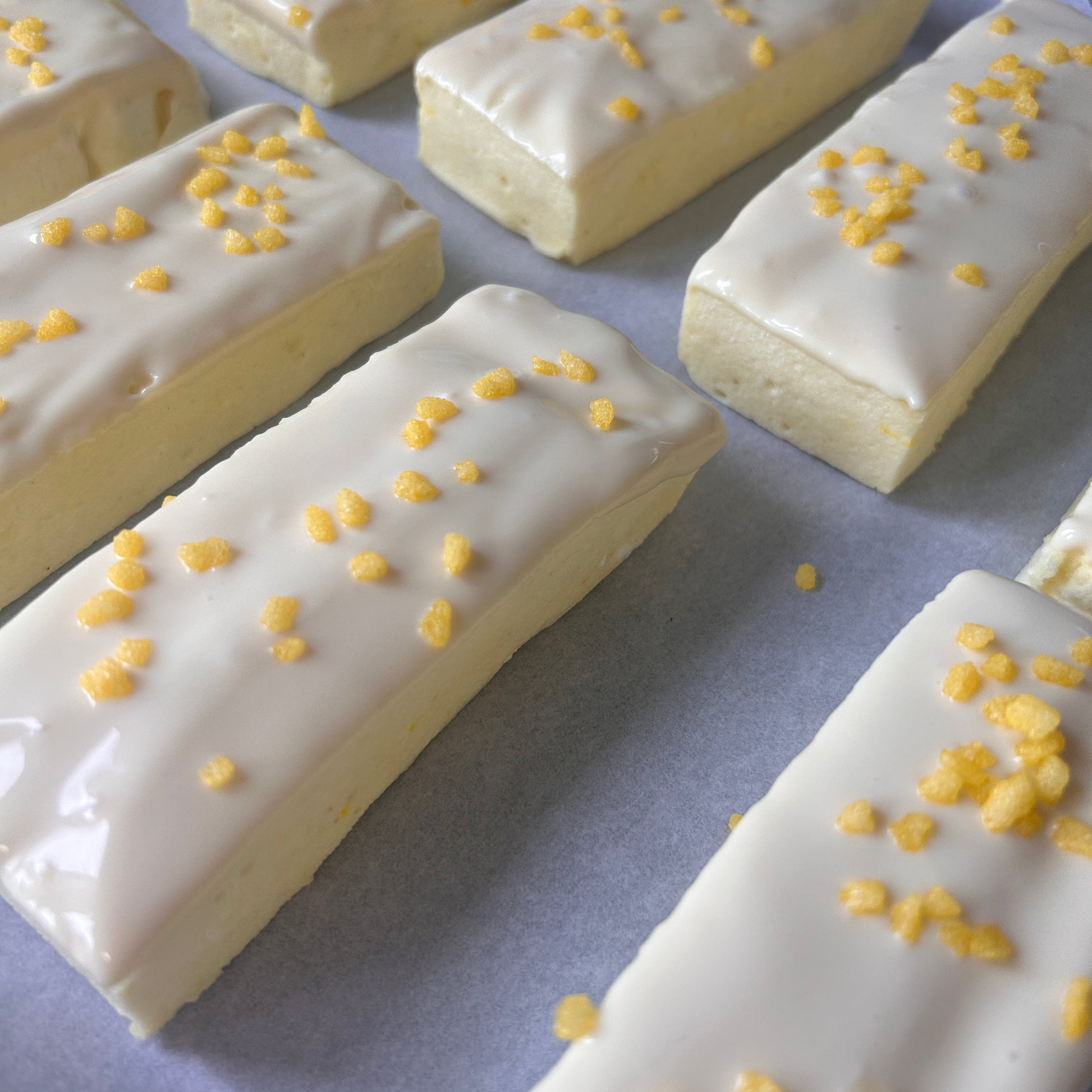 Low calorie Lemon and white chocolate protein marshmallow bars coated in white chocolate.