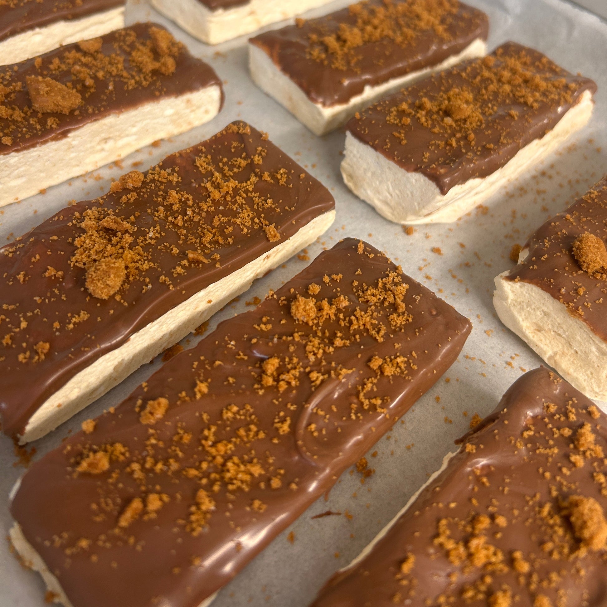 Caramelised Biscuit Protein Marshmallow Bar coated in milk chocolate, handmade in the UK by Trim Treats.