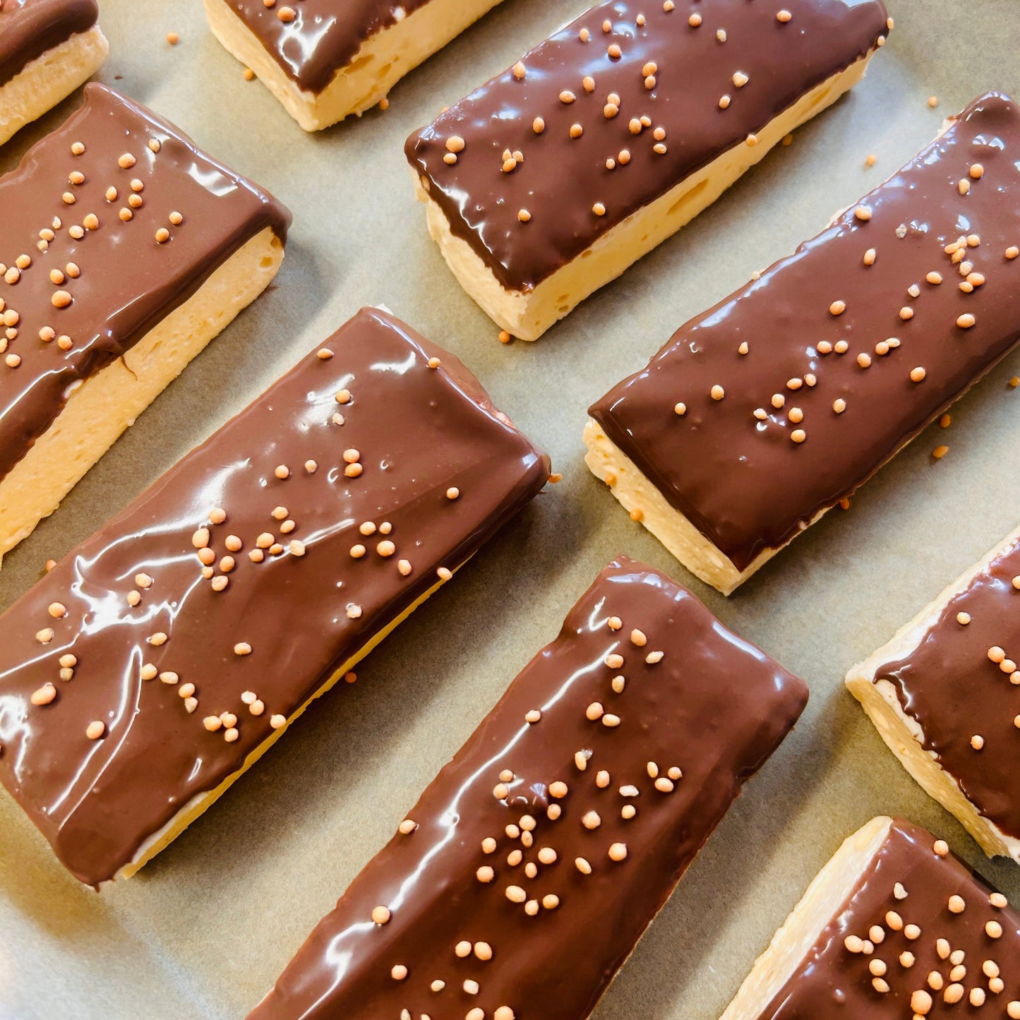 Orange Protein Marshmallow Bar coated in milk chocolate, handmade in the UK by Trim Treats.