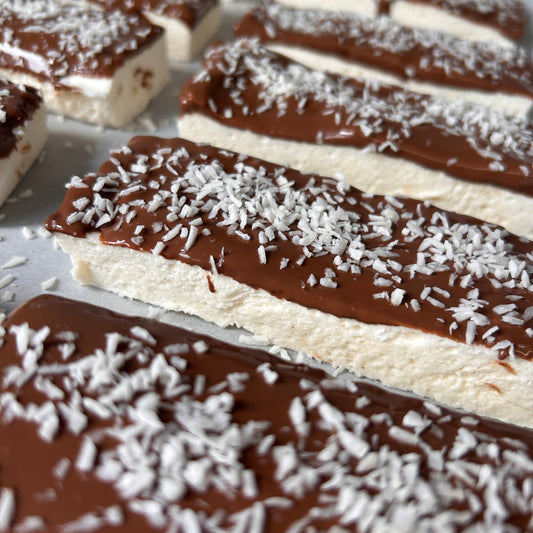 Coconut protein marshmallow coated in milk chocolate and desiccated coconut.